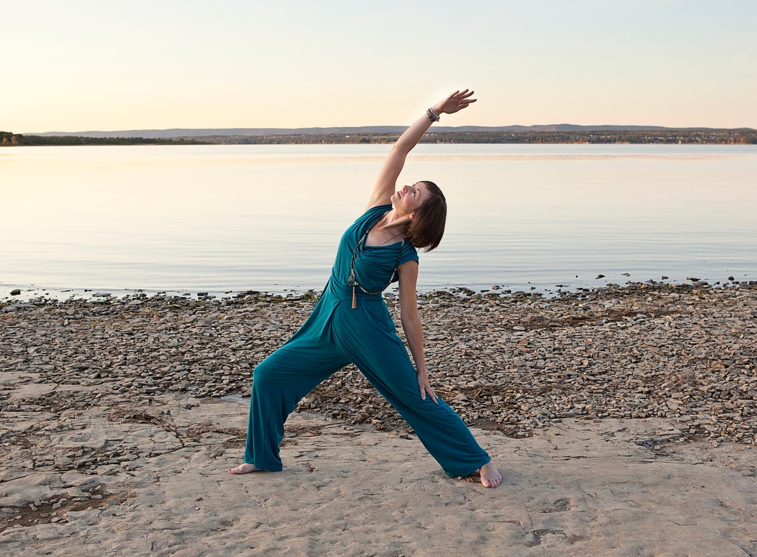 Jen Hastings, founder of Lunar Fusion Yoga, in reverse warrior pose
